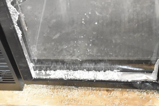 Brand new Avantco 178UBB48GTG 48" back bar refrigerator with broken glass. Features LED lighting, galvanized top, 115V, 1 phase.