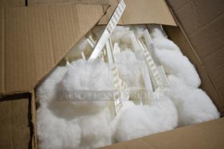 Alt Text: Open box showing white mop toilet bowl brushes with white handles, brand new condition.