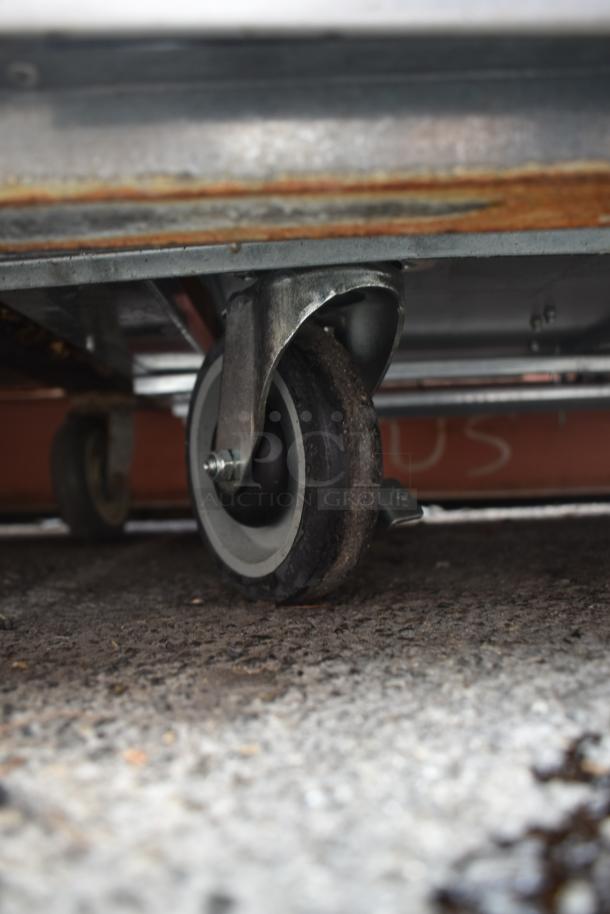 2023 Cooltech CUST-48LB Commercial Chef Base caster wheel, sturdy design, used condition, provides mobility.