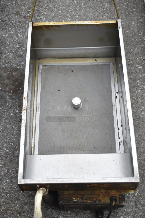Commercial grease trap, metal construction, moderate wear with visible stains and rust. Suitable for heavy-duty use.