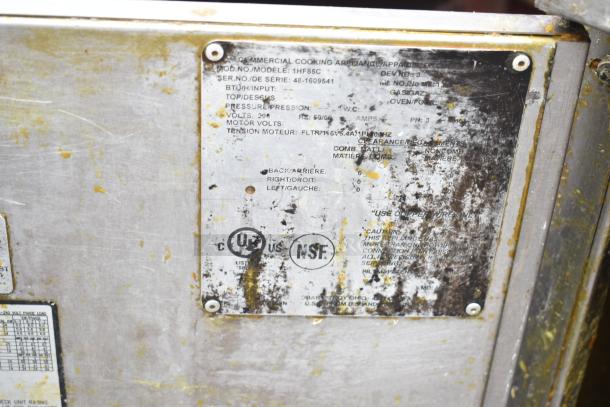 Hobart 1HF85C commercial deep fat fryer, marked with model, serial number, and certifications on a metallic label. Signs of wear.