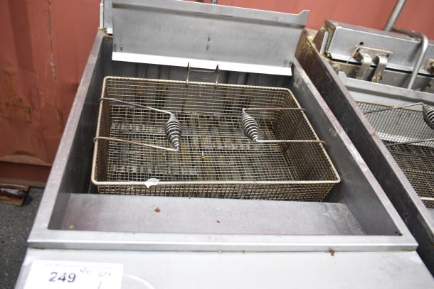 Hobart 1HF85C commercial fryer with dual baskets, stainless steel body, showing signs of use. Auction tag visible.