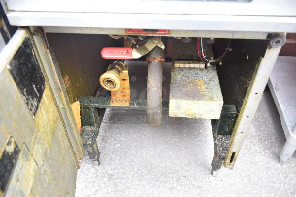 Hobart 1HF85C commercial deep fat fryer, floor style, visible wear and corrosion, model label partially legible.