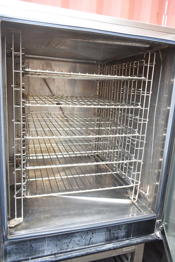 Electrolux Air-o-convect Touchline Commercial Convection Oven, model 9F92225200, on stand with casters, multiple racks visible.