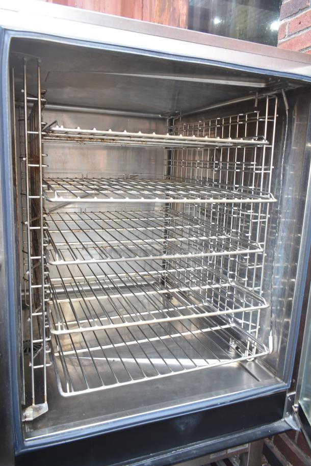 Electrolux Air-o-convect Touchline 9F92225200 commercial convection oven on stand with casters, shown open, in good condition.