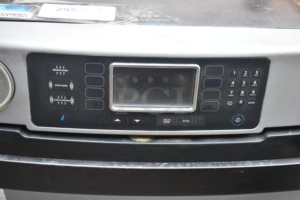 Turbochef Encore 2 rapid cook oven with digital controls, labeled buttons for cooking, and visible wear. Model 208/240V, 1 Phase.