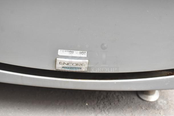 Turbochef Encore 2 countertop rapid cook oven, model label visible, shows "Caution - Hot." Powered by 208/240 volts, 1 phase.