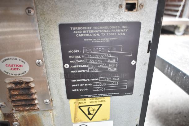 Turbochef Encore 2 commercial oven label showing model, serial number, voltage, and manufacturing details.