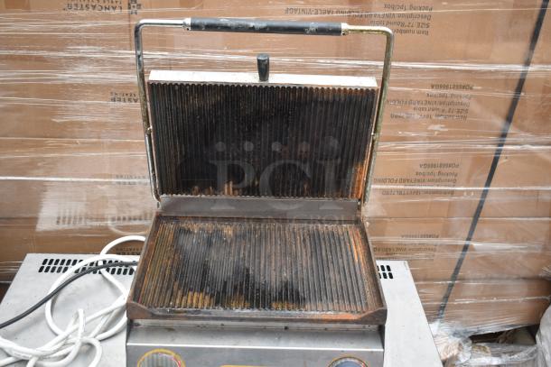 Isikgaz 2030-12 countertop panini press, 220-230V, 1 phase, used condition with visible wear on grill plates.
