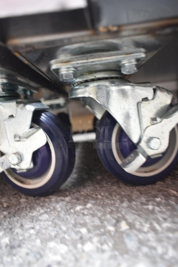 Lavex 257RD2523EBC mobile desk casters, showing sturdy metal construction and mobility features. Brand new condition.