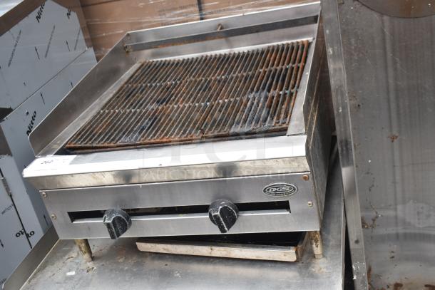 DCS Commercial Countertop Gas Charbroiler Grill on stand, stainless steel, dual control knobs, showing grill wear.
