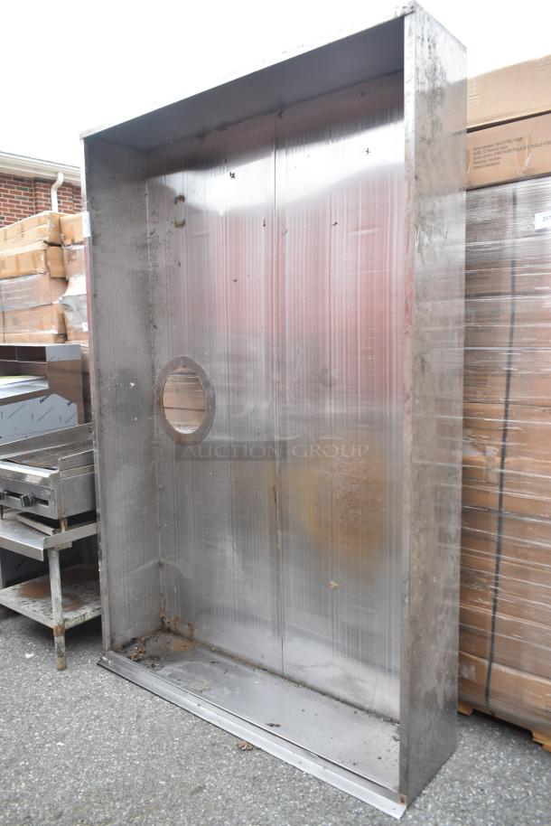 7.5' commercial steam hood, stainless steel, visible wear and rust, circular vent opening, used condition.