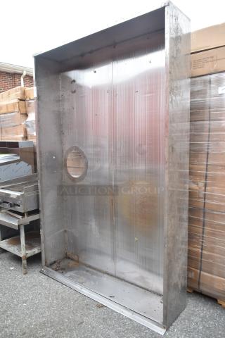 7.5' commercial steam hood, stainless steel, visible wear and rust, circular vent opening, used condition.
