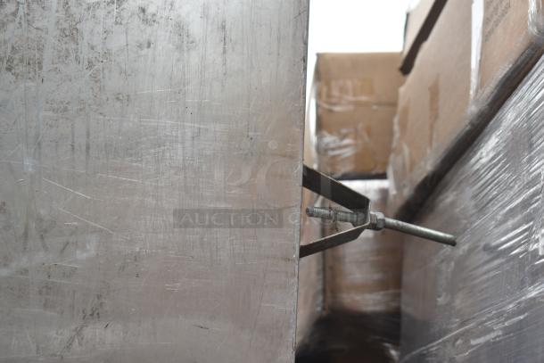 7.5' commercial steam hood with visible scratches on stainless steel surface, metal brackets, and installation bolts.