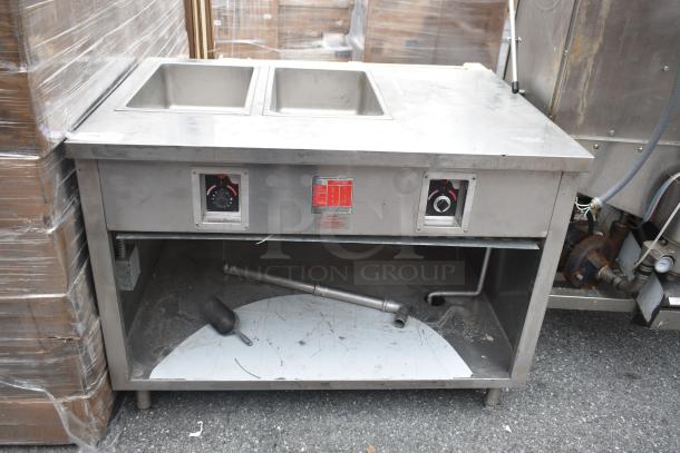 Commercial 2 Well Steam Table with Under Shelf, stainless steel, visible control dials, moderate wear, suited for food service.
