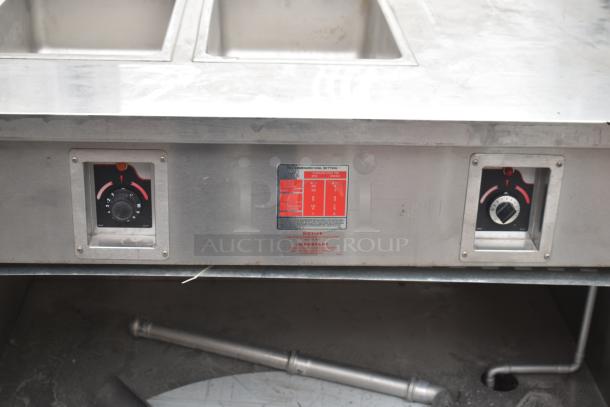 Commercial 2 well steam table with under shelf, stainless steel, dual control dials, visible settings tag, used condition.