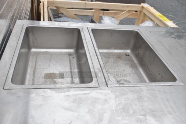Commercial 2 well steam table with under shelf, stainless steel, visibly used, surface wear, no visible markings or labels.