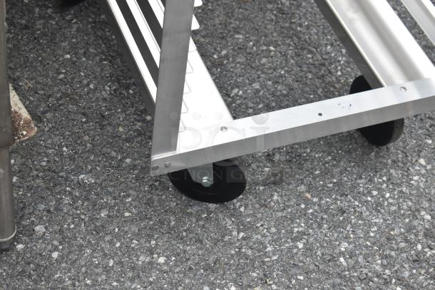 BRAND NEW Metro RF13N aluminum roll-in refrigerator rack, 36-pan capacity, with wheels. Scratch and dent condition visible.