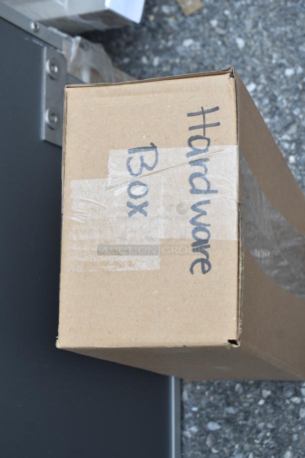 Cardboard box labeled "Hardware Box" for Regency 600TD3684 aluminum door, new with minor scratches, dimensions 36"x84".