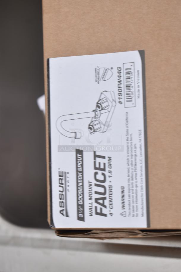 Brand new Regency 600HS12 12x16" wall-mounted hand sink with gooseneck faucet, labeled as scratch and dent. Box displays faucet details.