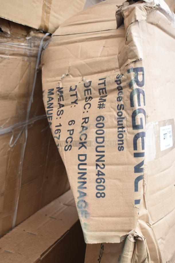 Damaged box labeled "600DUN24608 Rack Dunnage," containing six rack pieces, visibly scratched and dented packaging.