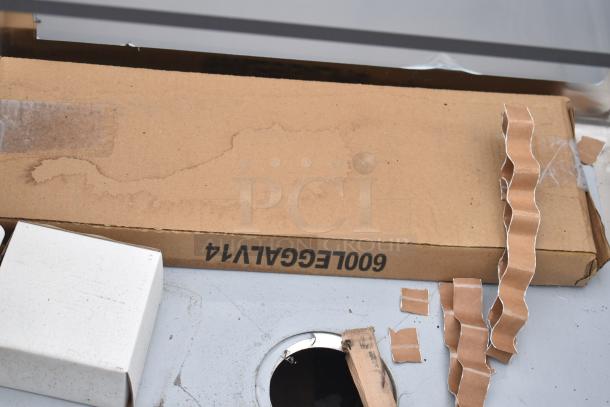 Regency 600S1242424L single bay sink with left side drain board, new, scratch and dent, shown in packaging with visible markings.