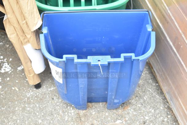 Brand new blue bucket with capacity markings; tag indicates auction item. Part of a dual bucket offering.