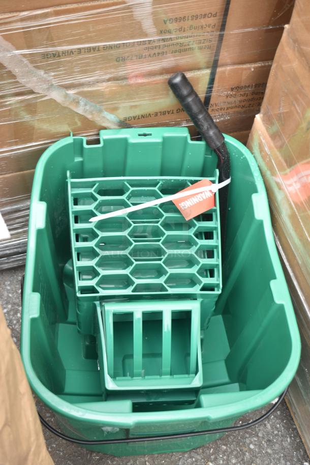 Sparta Green Mop Bucket, brand new with minor scratches. Includes a warning tag. Auction for two similar items.