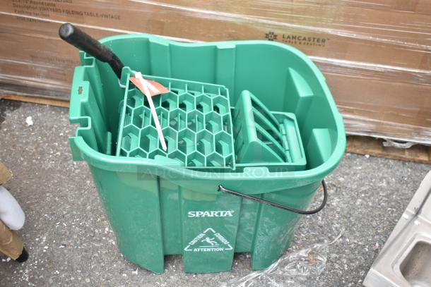 Green Sparta mop bucket with handle, brand new, includes caution label.