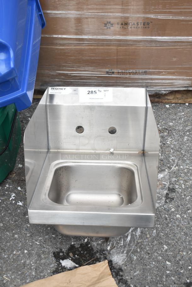 Brand new Regency 600HS12HSP wall-mounted hand sink, 9"x9"x5", with 4" centers, side splash, and strainer; minor scratches.