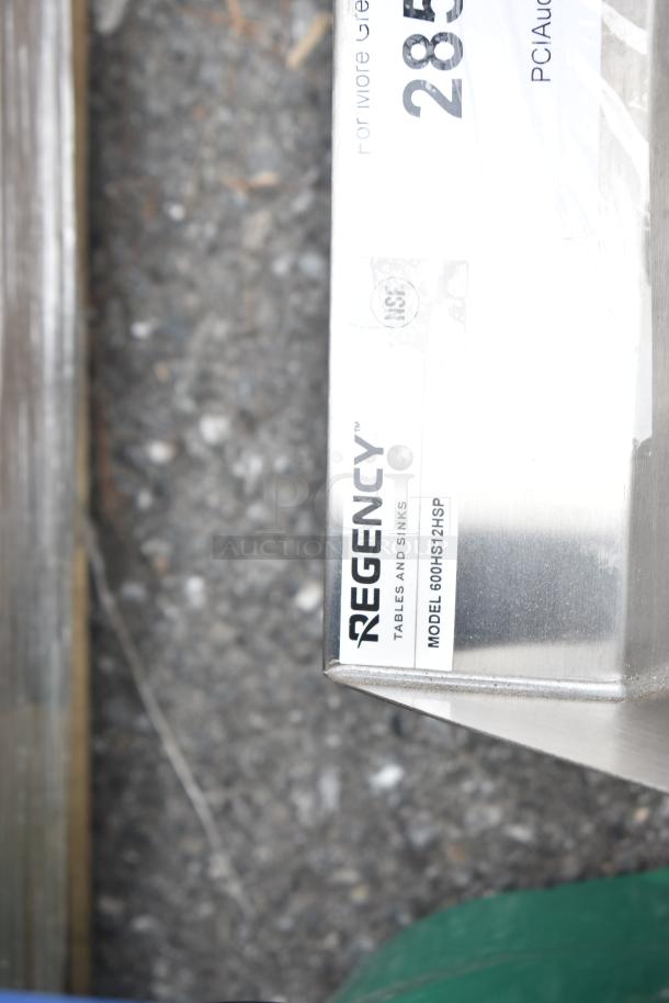 BRAND NEW Regency 600HS12HSP wall-mounted hand sink, 9"x9"x5", with 4" centers, side splash, strainer, minor scratches.