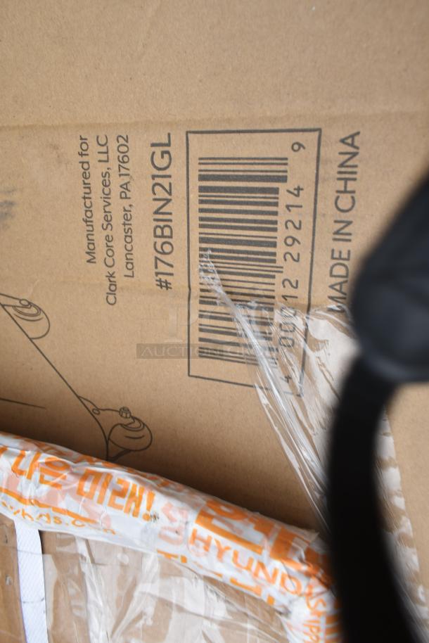 Cardboard box labeled "Manufactured for Clark Core Services, Lancaster, PA". Contains new scratch and dent items.