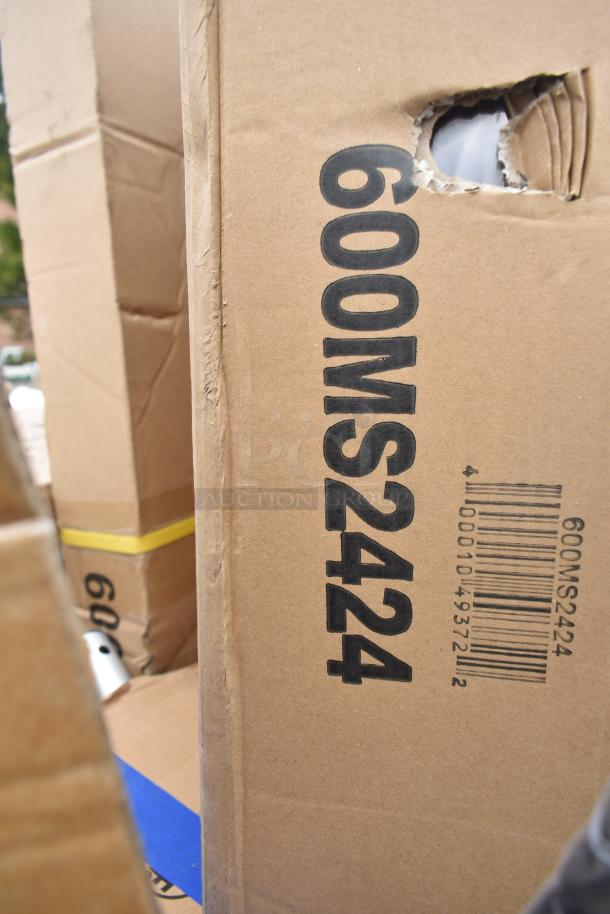 Cardboard box with "600MS2424" text and barcode, containing new scratch and dent items like a microwave shelf and drop-in sink.
