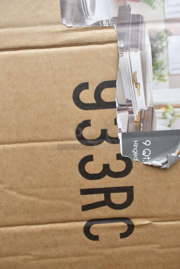 Cardboard box labeled "933RC" with a partially visible image of a 9 qt hinged chafer. Box is part of a scratch and dent auction lot.