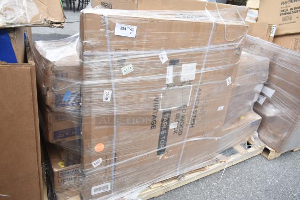 Seven brand new scratch and dent items, including a shelf kit and sink, on a pallet. Boxes are wrapped in plastic with labels showing item codes and details.