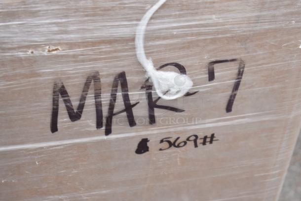 13 brand new scratch and dent items wrapped on pallet, labeled "MAR-7" and "#569". Includes table and speed rail.