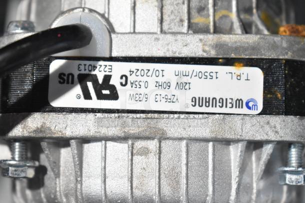 Brand new Avantco 17816223 fan motor, 120V, 33W, scratch and dent condition. Label indicates model and specifications.