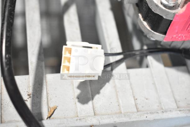 Brand new Avantco 17816223 fan motor with 120V, 33W. Slight cosmetic scratches and dents visible.