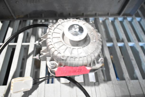 Brand new Avantco 17816223 fan motor, 120V, 33W. Scratch and dent condition, visible label with specification details.