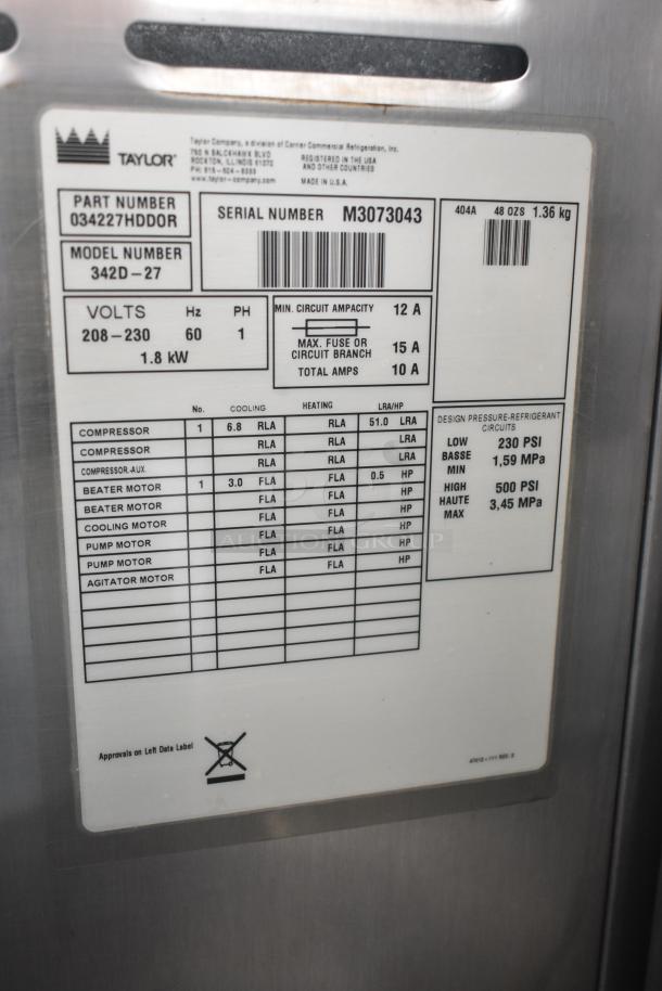 Taylor 342D-27 Commercial Frozen Beverage Machine label showing model details, 208/240V, 1 phase. Serial number M3073043.