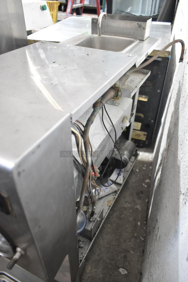 Taylor Commercial Countertop Single Flavor Frozen Beverage Machine, 115 Volts, 1 Phase. Visible wear, stainless exterior, wires exposed.