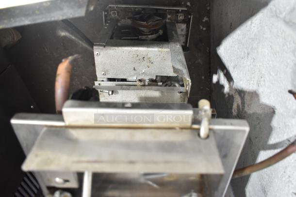 Taylor single flavor frozen beverage machine interior. Visible wear and parts, 115 volts, 1 phase. For commercial use.