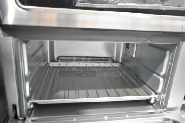 Brand new Chefman RJ50-SST2-P ExacTemp Air Fryer Toaster Oven Combo. Internal oven view, 115 volts, 1 phase, with rack.