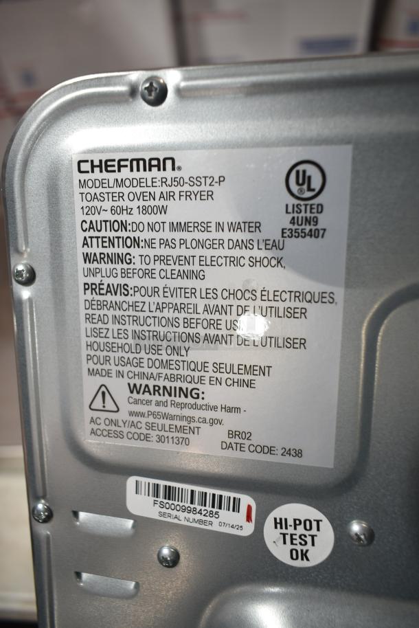 Brand new Chefman RJ50-SST2-P air fryer toaster oven, 115V, with caution and warning labels, model details visible.