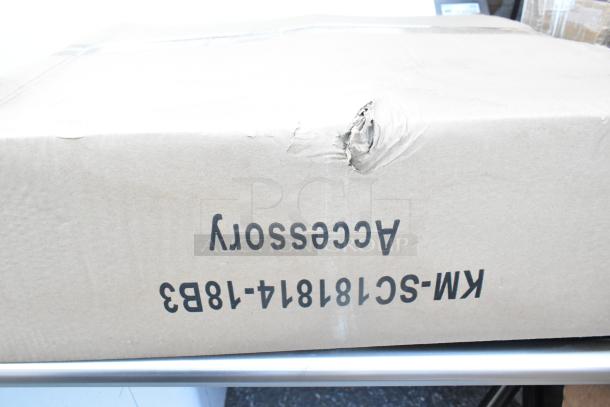 Cardboard box for KoolMore KM-SC181814-1883 stainless steel 3 bay sink with visible dents and product code markings.