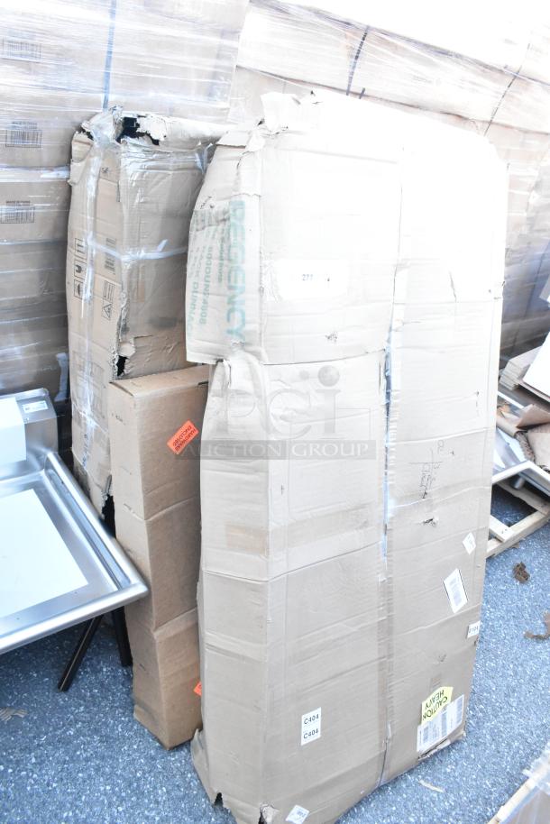 Three new scratch and dent items including racks. Regency branded, packaging damaged. Caution labels visible.