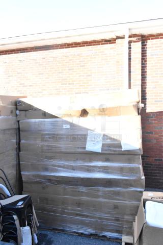 12 new Lancaster Vineyard 5' round folding tables, scratch and dent, palletized, in boxes with product labels visible.