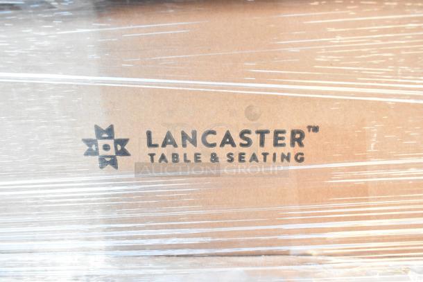 Alt Text: Close-up of Lancaster Table & Seating logo on packaging for 12 new scratch and dent Vineyard 5' round folding tables.