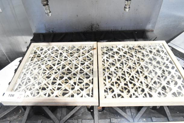 Two framed lattice-patterned pictures with light wood frames. Visible label: Lot 106, Quantity 2.