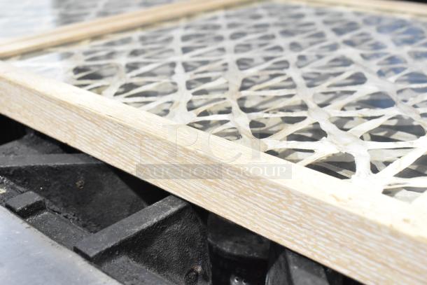 Two framed pictures with intricate lace-like design under glass, light wood frame, excellent condition.